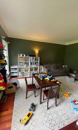 Family room accent wall painted in a rich olive green - interior painting.
