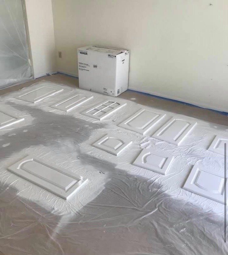 Cabinet doors staged and prepped for refinishing. — cabinet painting, cabinet refinishing, cabinet prep