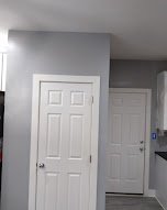 Hallway with freshly painted doors and trim - interior painting.