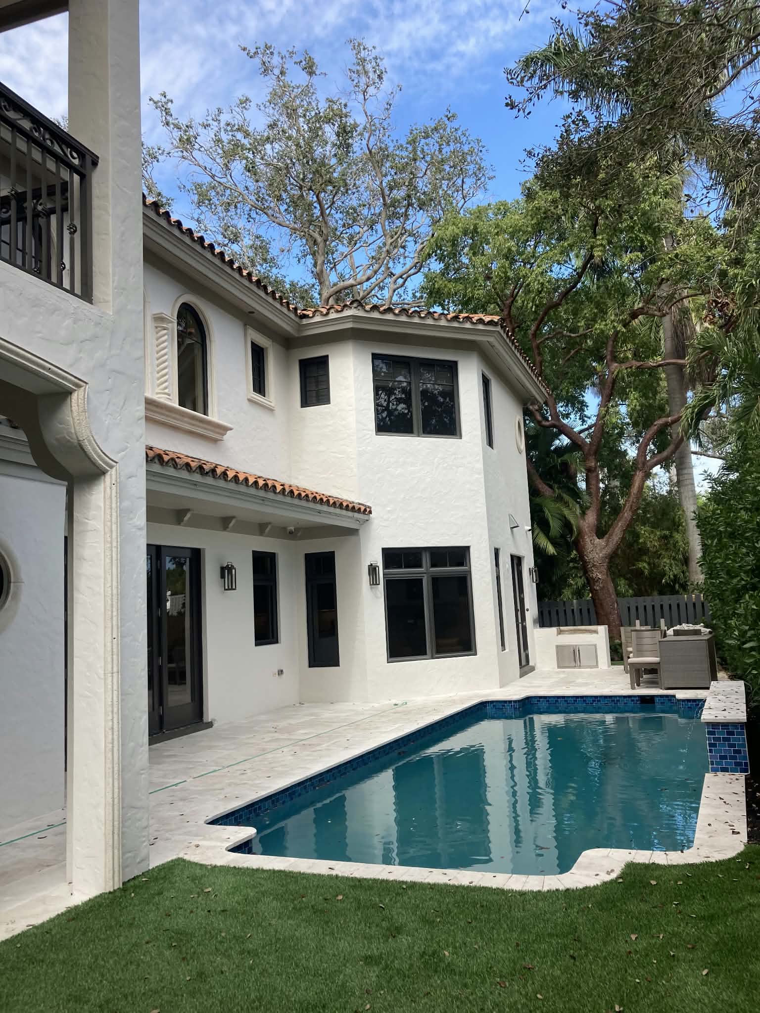 Full exterior repaint of a two-story stucco home. — exterior painting, stucco painting, house repaint, full exterior repaint