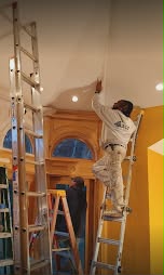 Fine-finish painting of an ornate archway and soffit near a grand entryway - fine-finish painting.