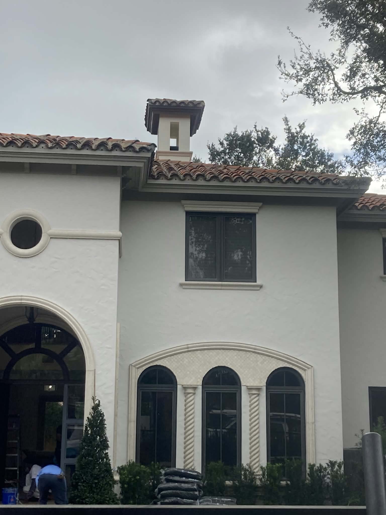 Exterior trim and chimney surround freshly painted. — exterior trim painting, chimney surround, roofline painting