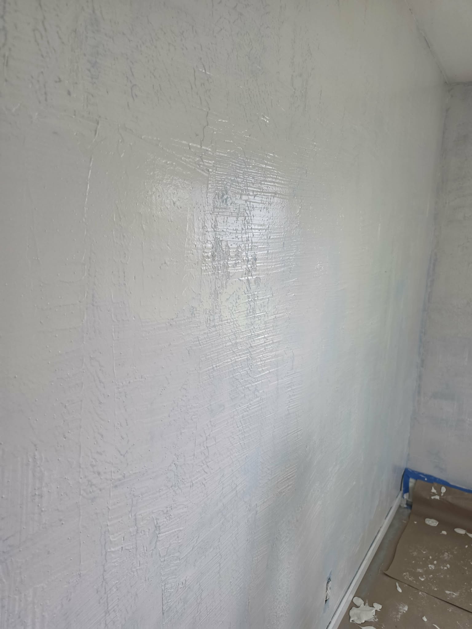 Smooth skim-coat finish on a repaired wall — skim coating, drywall repair Easton PA, smooth wall finish, Level 5 drywall finish, Randy's Painting & Drywall Services, Lehigh Valley drywall repair, Bucks County wall restoration