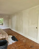 Interior room prepped and painted in a soft neutral tone - interior painting.