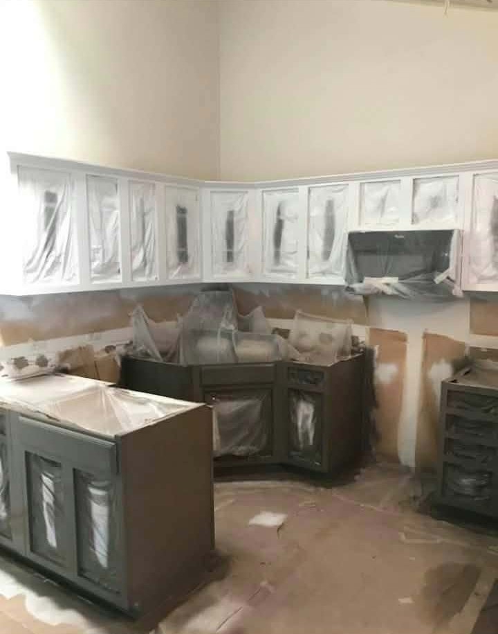 Kitchen Cabinet Repaint — Doors & Drawer Fronts Refinished — kitchen cabinet painting, cabinet refinishing, cabinet door repaint, cabinet spray painting, interior painting, dark gray cabinets, drop cloth prep, paint buckets, cabinet drawer fronts, home renovation, cabinet makeover, before and after
