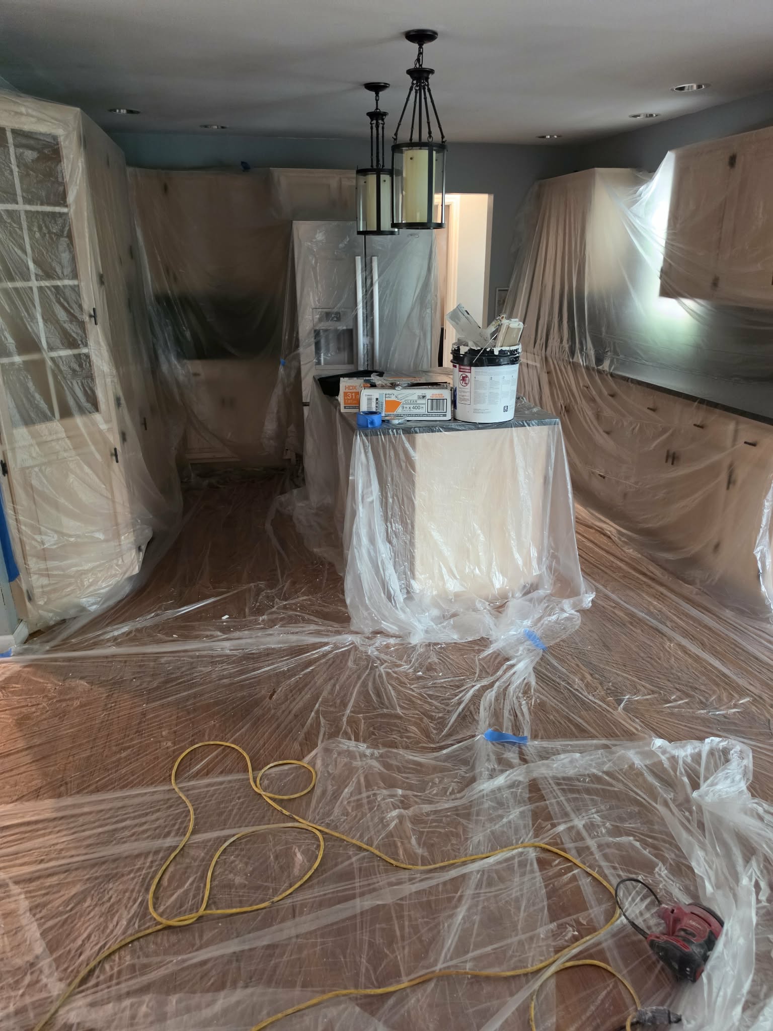 Kitchen fully masked and prepped for cabinet refinishing — kitchen cabinet refinishing, cabinet painting Easton PA, cabinet spraying, Randy's Painting & Drywall Services, Lehigh Valley kitchen remodel, Bucks County painters